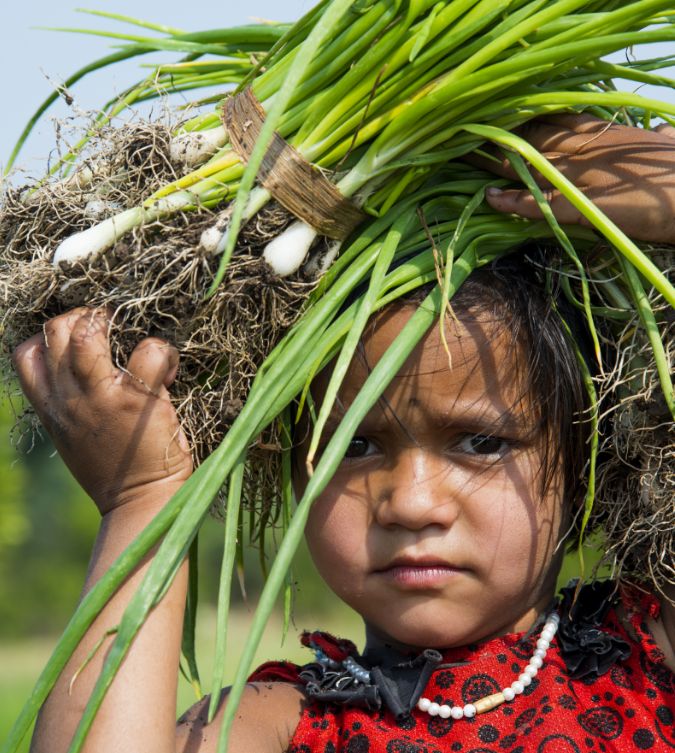 child-carrying-greens-portrait