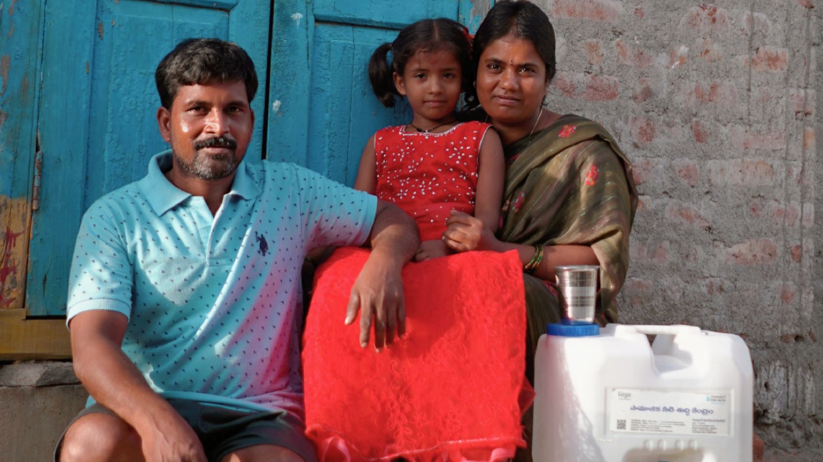 Family with water container